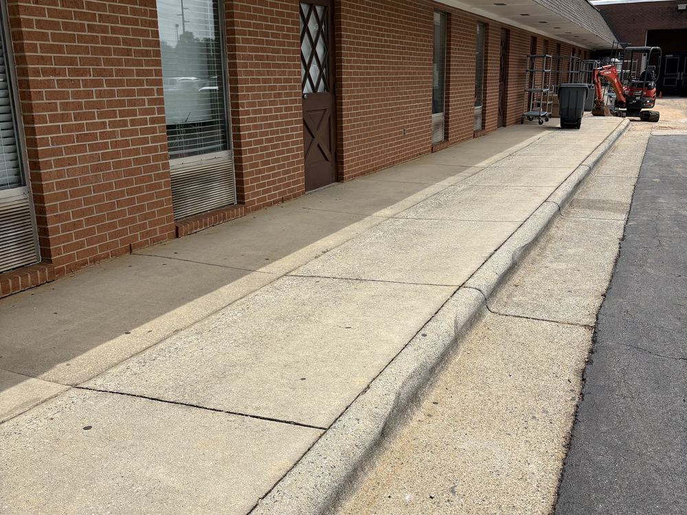A long commercial sidewalk after cleaning